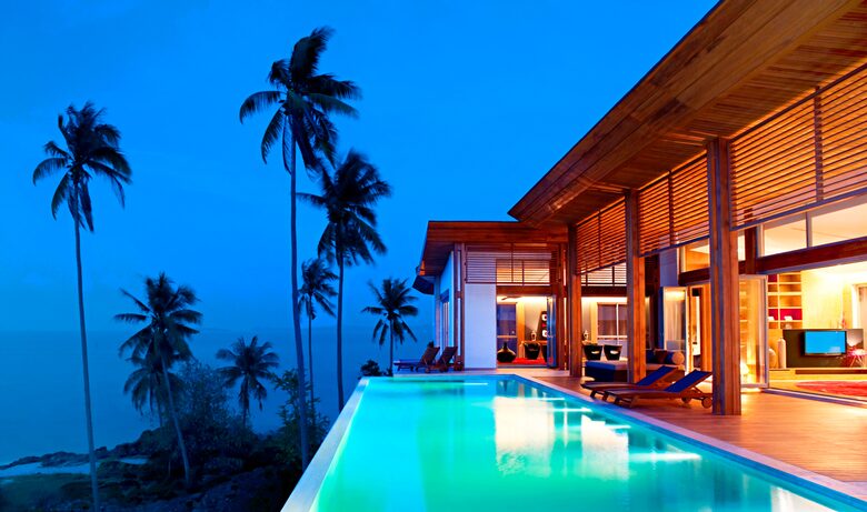 Outside of a Ko Samui villa that sits cliffside with an infinity pool.