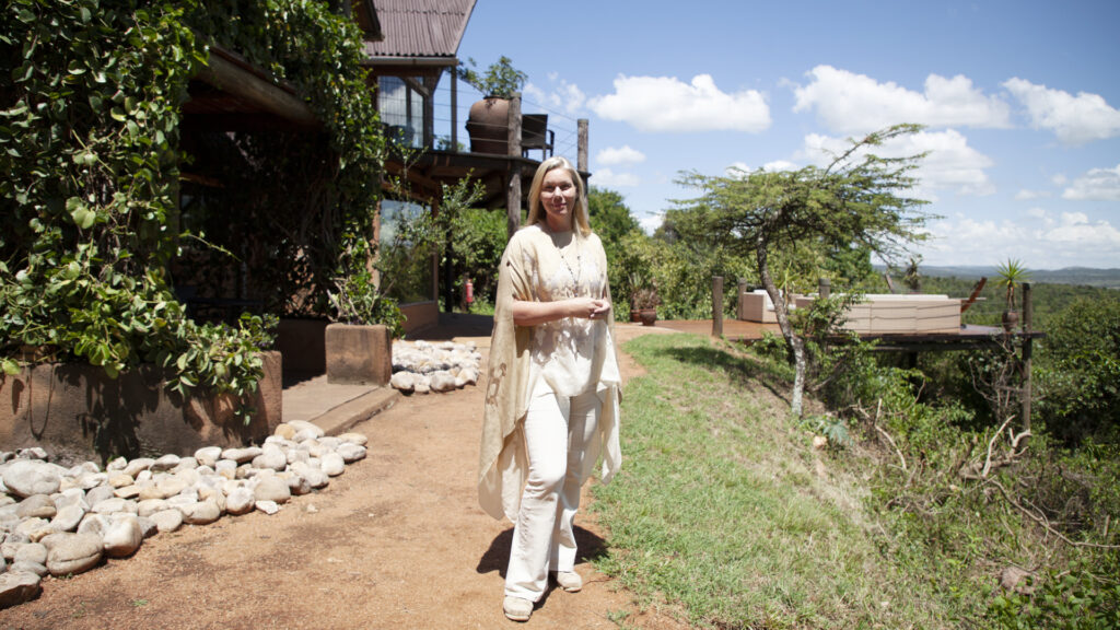 Millionaire Holiday Home Swap participant Louise Cottar in front of Cottar's Mara Private Homestead in Masai Mara, Kenya