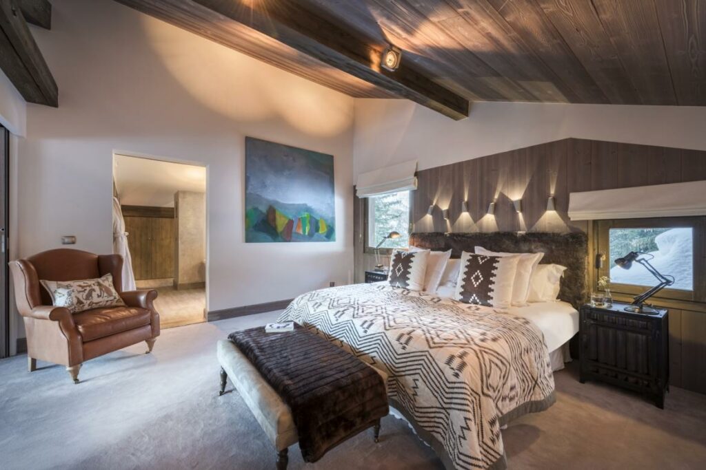 Bedroom with king-sized bed inside Chalet Les Brames