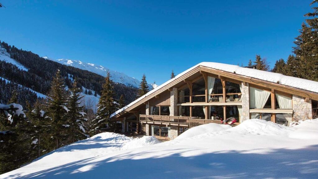 Exterior of Chalet Les Brames on a snowy, sunny day