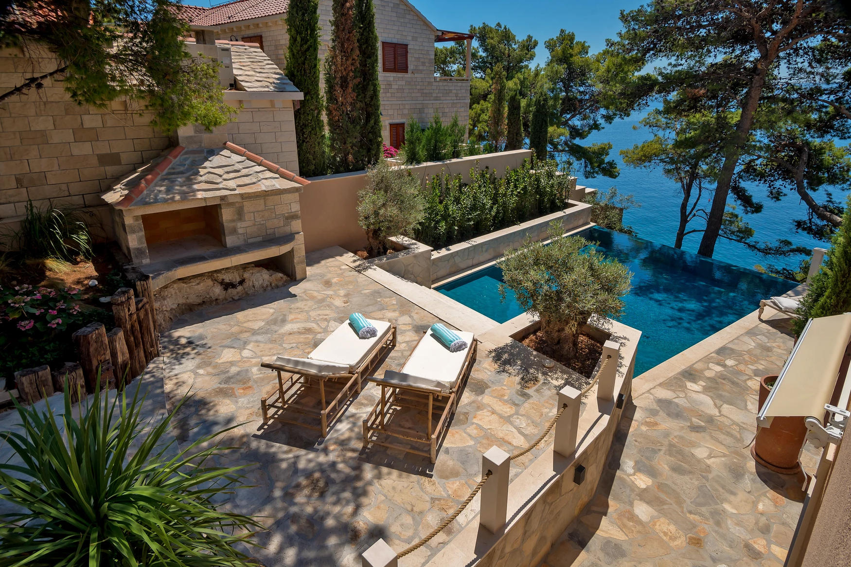 Maison Mala's terrace with loungers and pool
